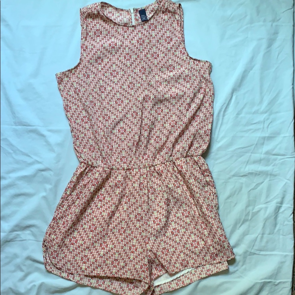 Multi-colored romper with pockets.